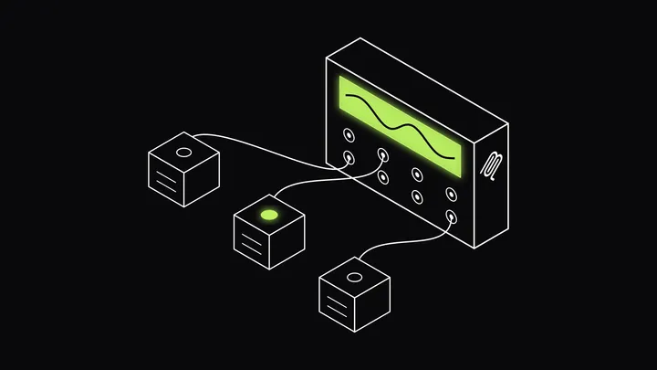 A switchboard patched into three tool units, with the middle unit's lamp glowing lime